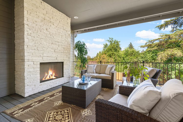 Tulane Meadows home outdoor living area with fireplace